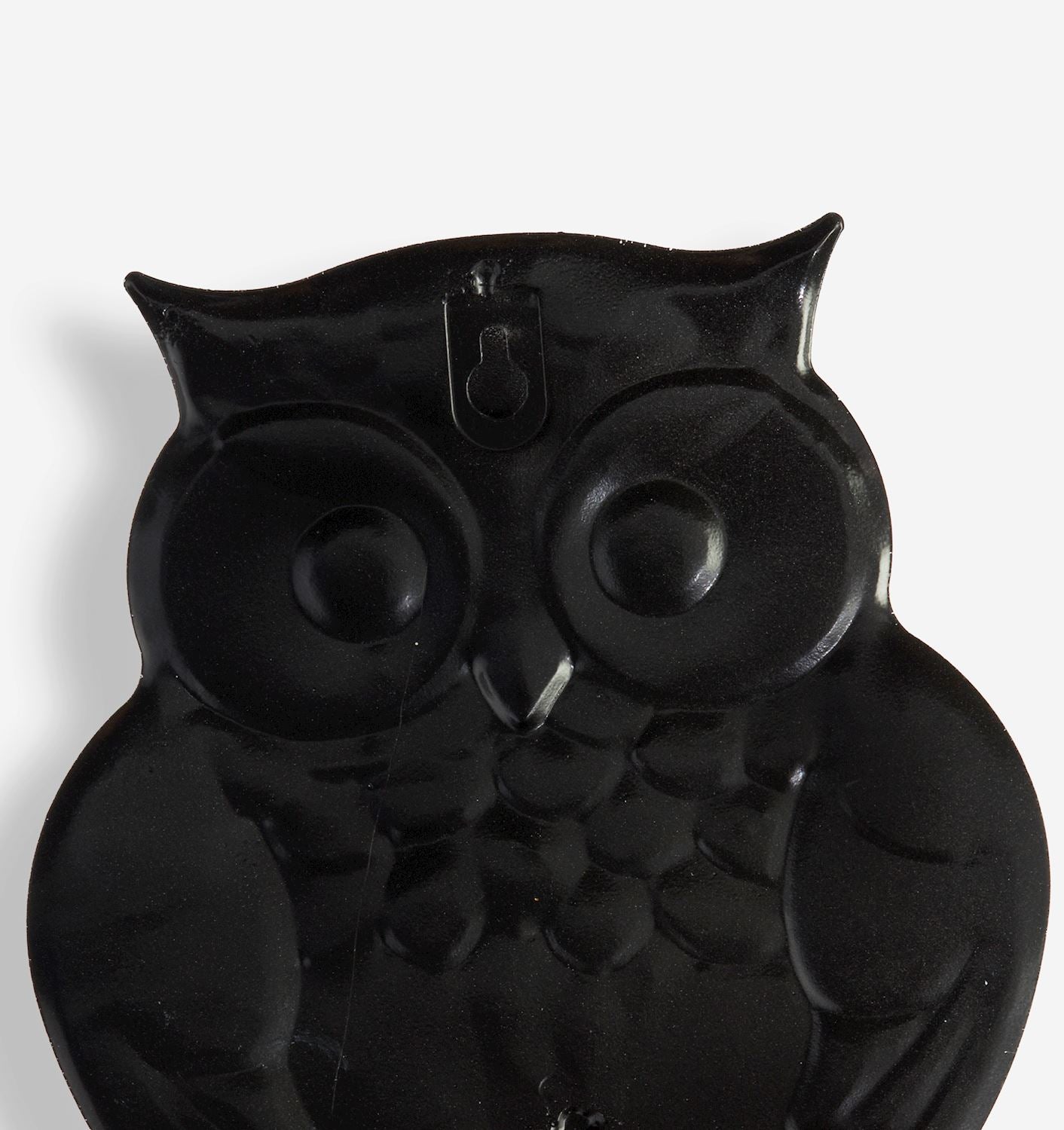 The Black Backing of owl-shaped object on a white background