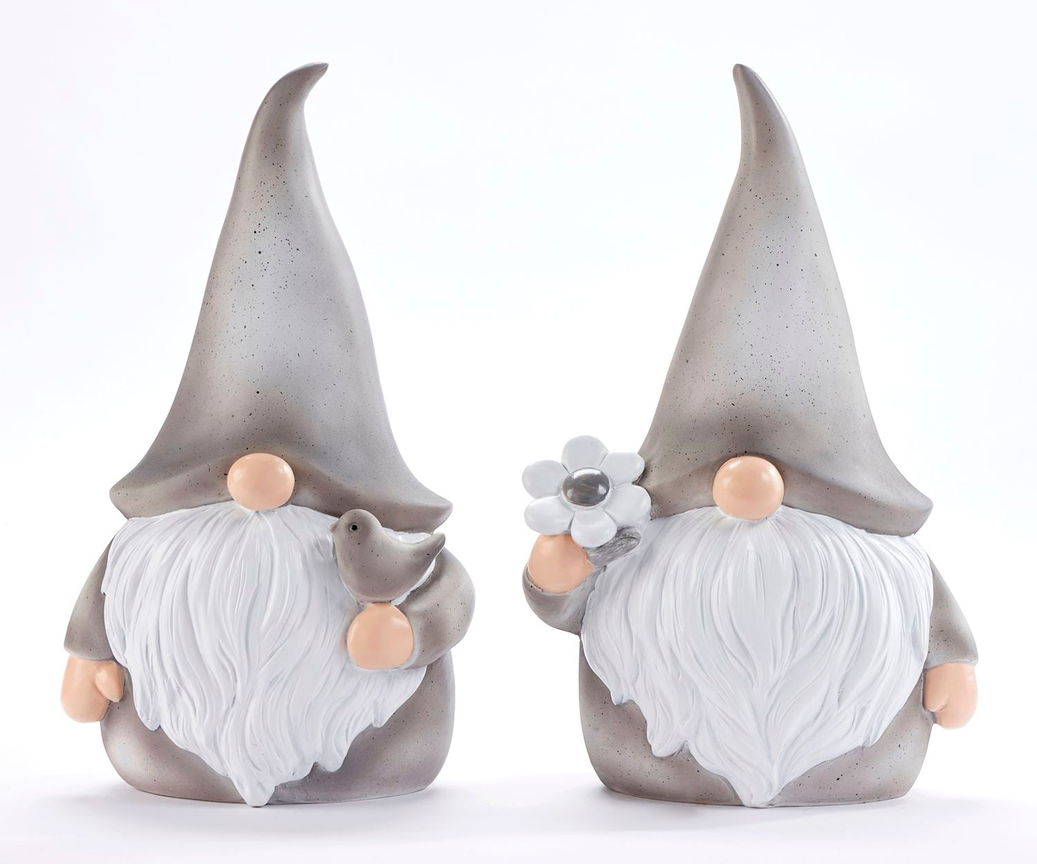 Two ceramic figurines of gnomes, one with a bird design and the other with a daisy design, both with pointed hats and beards.