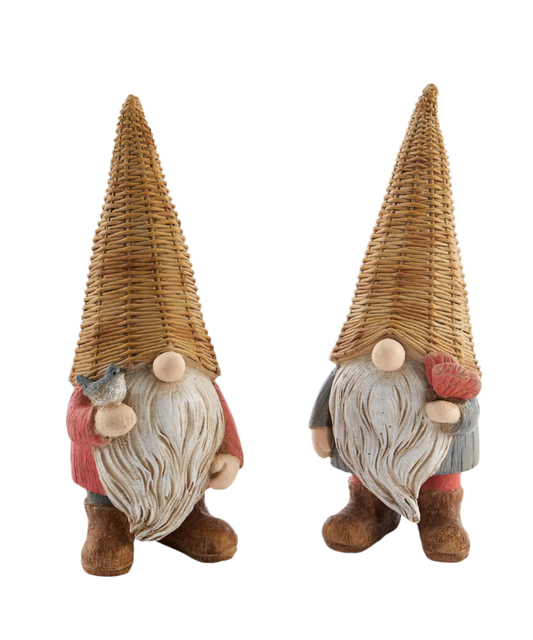 Two decorative gnomes, one with a butterfly-like pattern and the other resembling a bird, made of a wicker-like material with fabric details, painted in shades of blue, brown, and beige.