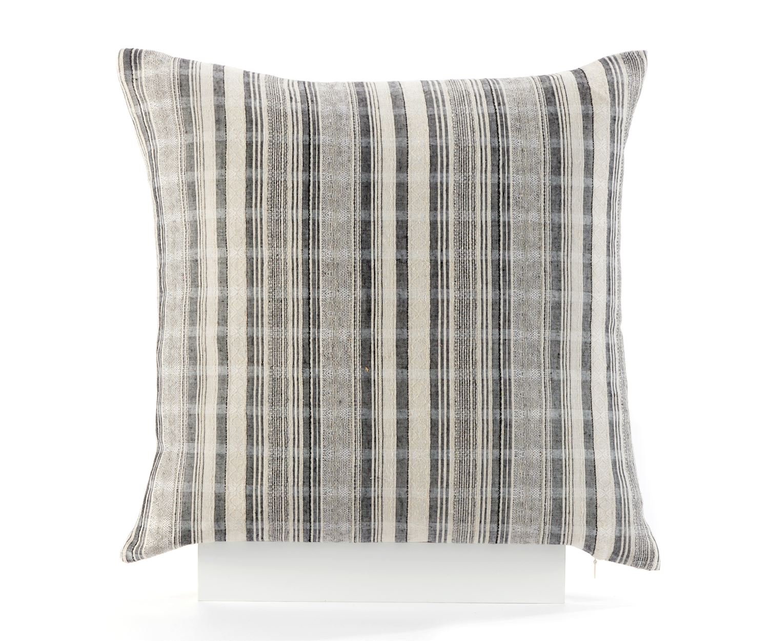 A square-shaped polyester throw pillow with a striped black and white design on a white background.