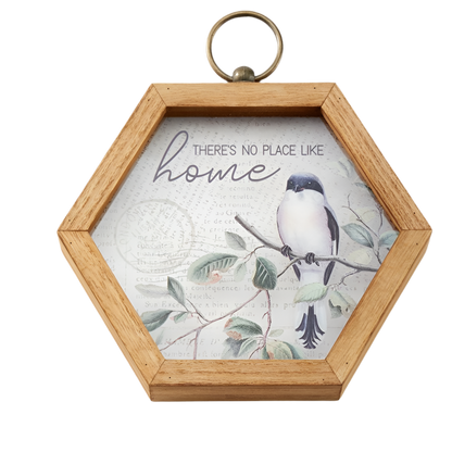 Hexagonal wooden frame with a bird illustration and 'There's no place like home' text on a white background