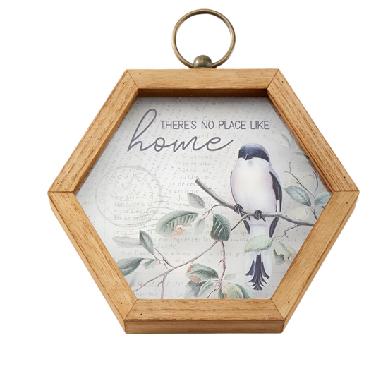 Hexagonal wooden frame with a bird illustration and 'There's no place like home' text on a white background