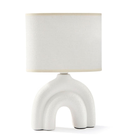 A white ceramic table lamp with a textured base and a white polyester shade, displayed against a plain background.