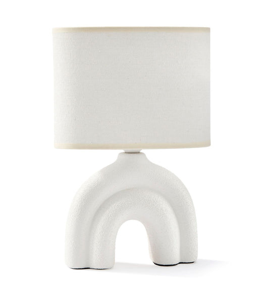 A white ceramic table lamp with a textured base and a white polyester shade, displayed against a plain background.